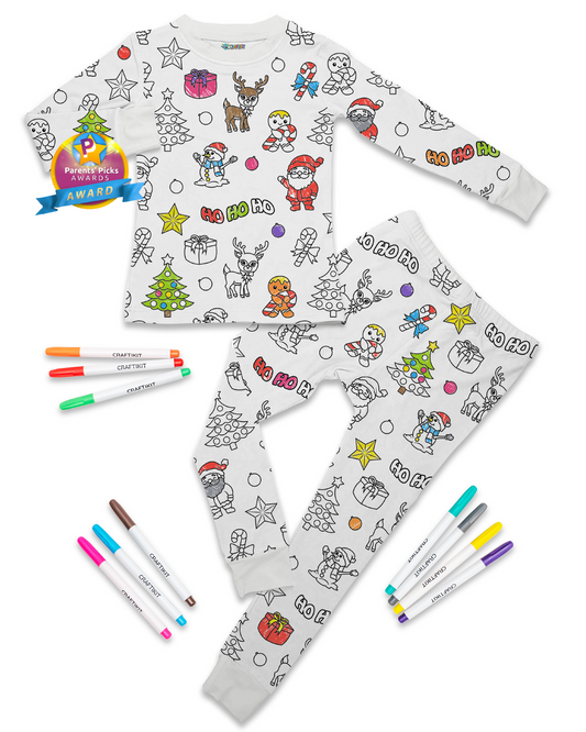 Children's pajama set with Christmas-themed print and markers on a white background